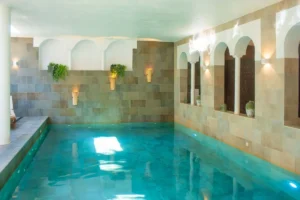Indoor Pool with Stone Walls and Natural Light