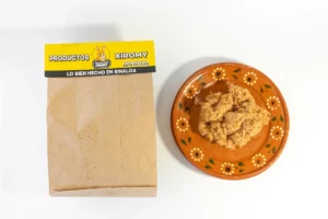 A bowl of food next to a bag of food