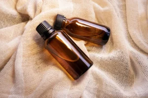 Mock-up amber glass bottles on natural background